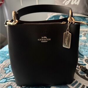 Coach Black Leather Shoulder Bag with Gold Accents
New! Used one time! No flaws🎀